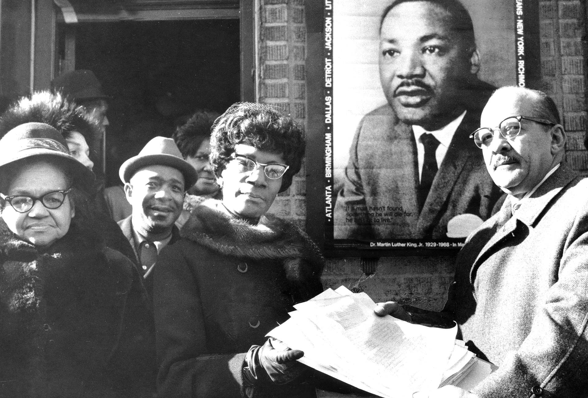 Rep. Shirley Chisholm receives petitions asking Congress to designate January 15, a national holiday in honor of Martin Luther King, Jr.